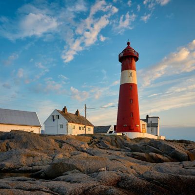 Lighthouse at daytime with clear blue sky behind